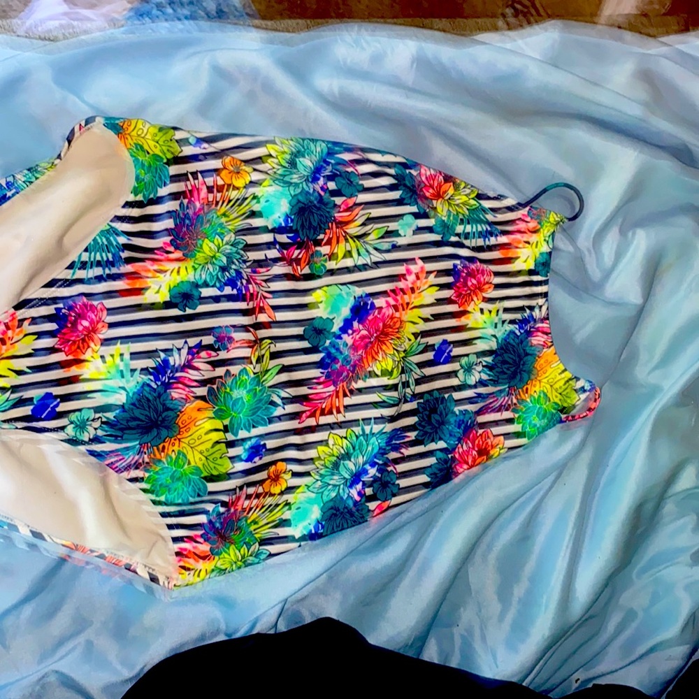Giving away a bathing suit for kid it is rainbow and it has flowers on it